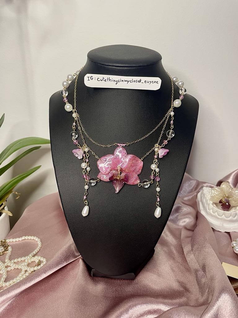 pink real orchid with pink lily of the valley fairy 🧚‍♂️