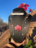 pink real orchid with pink lily of the valley fairy 🧚‍♂️