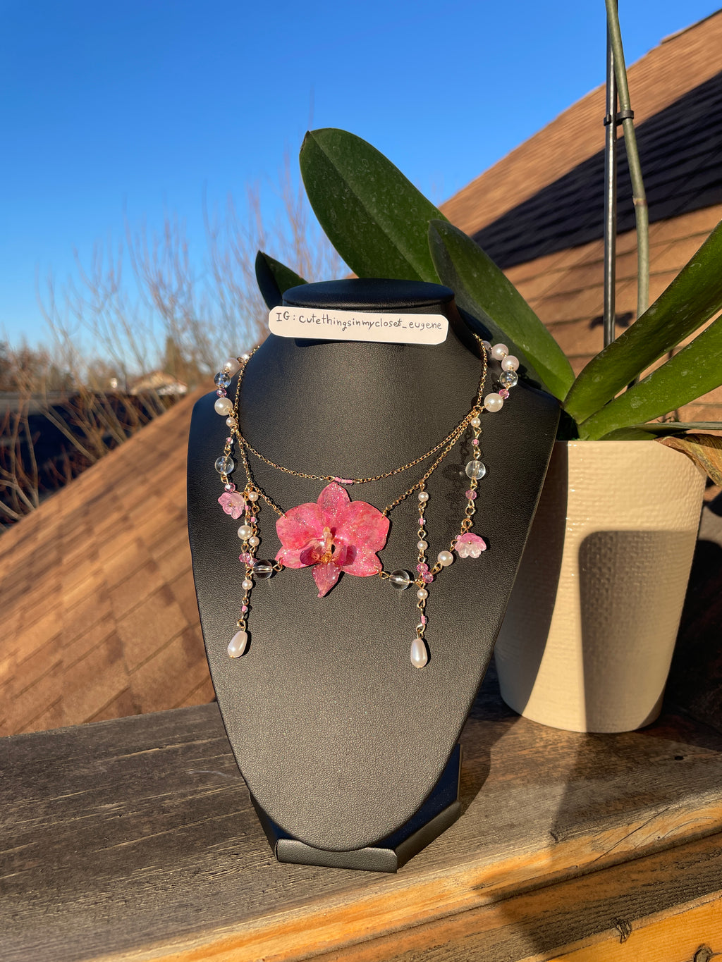 pink real orchid with pink lily of the valley fairy 🧚‍♂️
