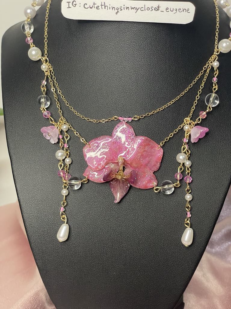 pink real orchid with pink lily of the valley fairy 🧚‍♂️