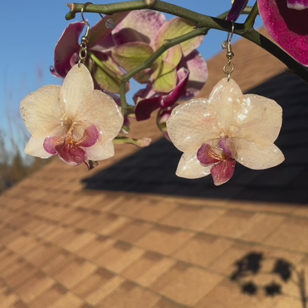Real orchids earrings nurture color.
